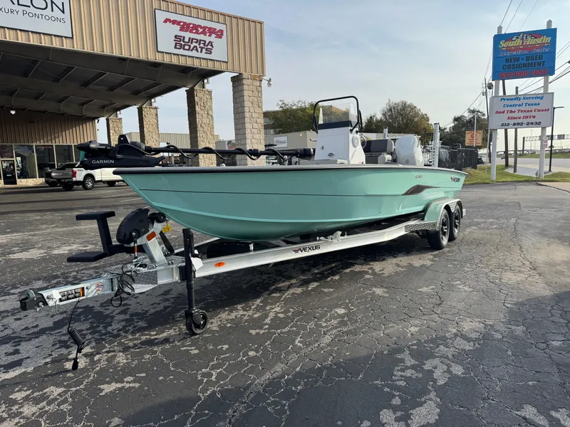 Slide: The Image of 2025 Vexus ACX 2210 boat on trailer outside dealership. - 4