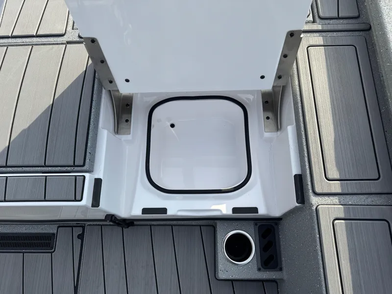 Slide: The Image of Vexus ACX 2210 2025 boat deck with storage compartment and cup holder. - 41