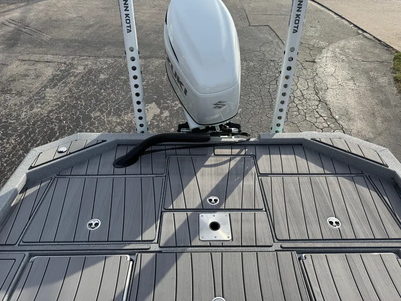 Slide: The Image of 2025 Vexus ACX 2210 boat deck with motor and storage compartments. - 44