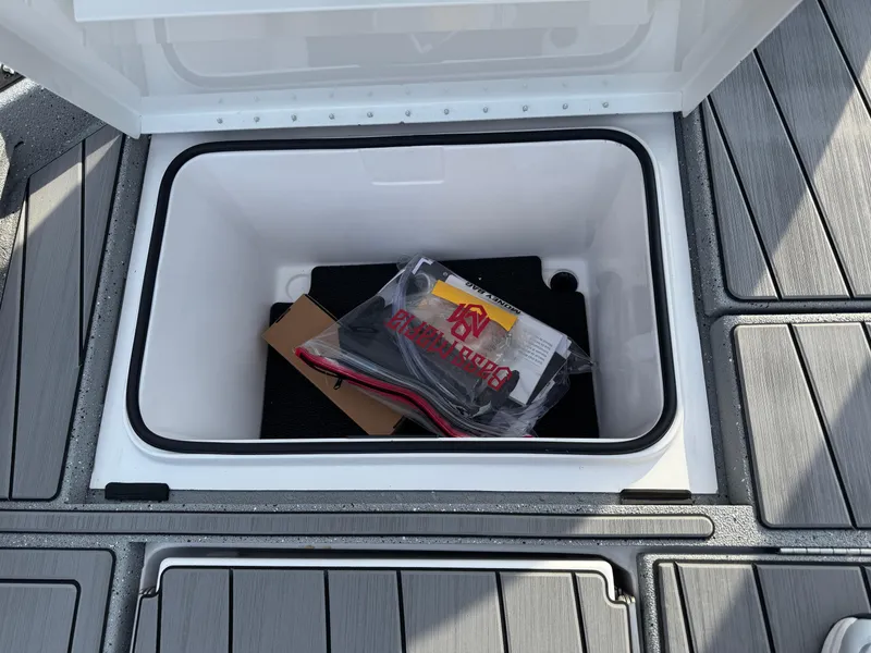 Slide: The Image of Open storage compartment on 2025 Vexus ACX 2210 boat deck. - 45