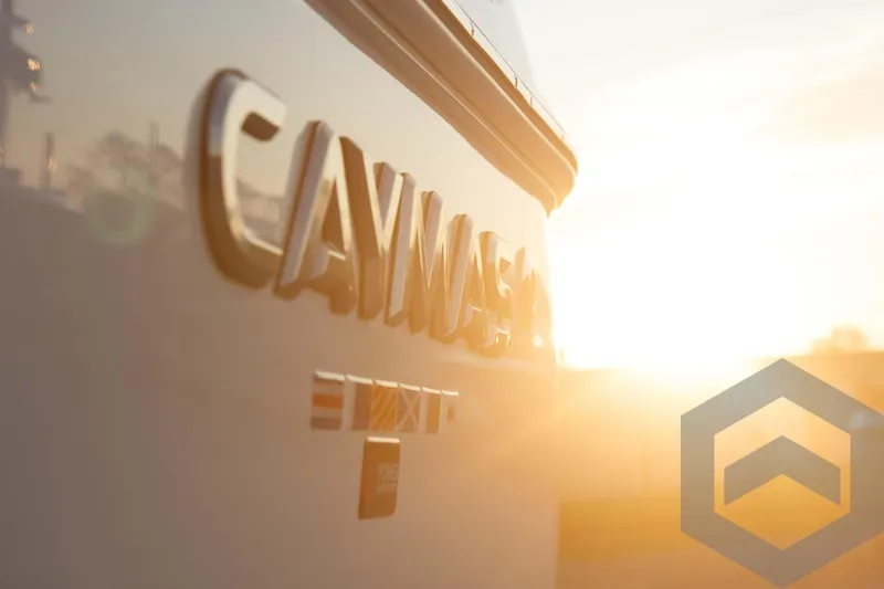 Slide: The Image of 2025 Caymas 26 HB boat with sunset background. - 23