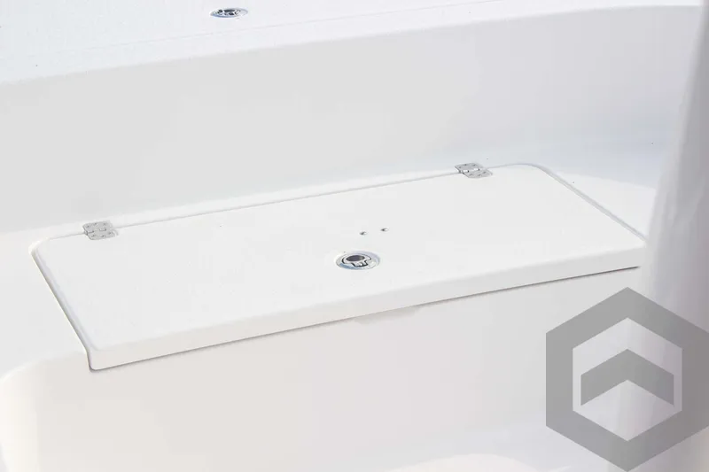 Slide: The Image of 2025 Caymas 26 HB boat storage compartment with sleek white finish. - 25