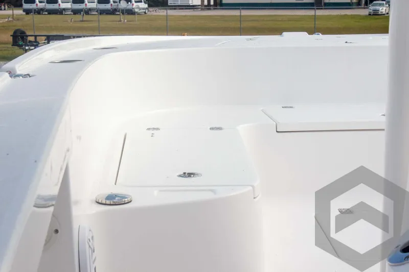 Slide: The Image of 2025 Caymas 26 HB boat deck, featuring sleek white design and spacious layout. - 29