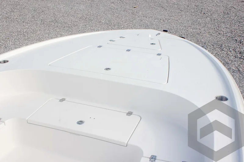 Slide: The Image of 2025 Caymas 26 HB boat deck with storage compartments. - 30