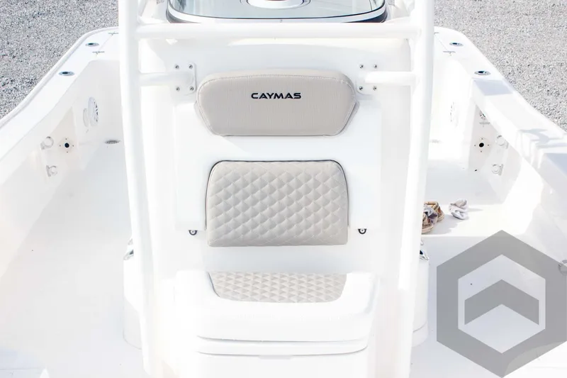 Slide: The Image of 2025 Caymas 26 HB boat interior with cushioned seating and modern design. - 32