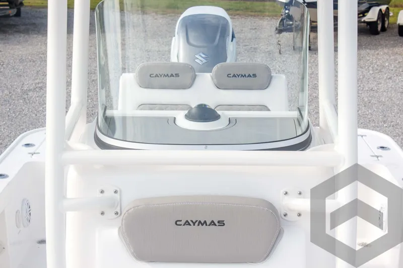 Slide: The Image of 2025 Caymas 26 HB boat console with windshield and seating, featuring modern design elements. - 33
