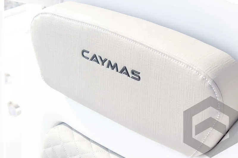 Slide: The Image of Caymas 26 HB 2025 boat seat with logo, featuring elegant stitching. - 35