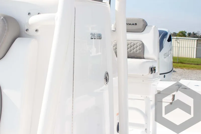 Slide: The Image of 2025 Caymas 26 HB boat interior with seating and console details. - 38