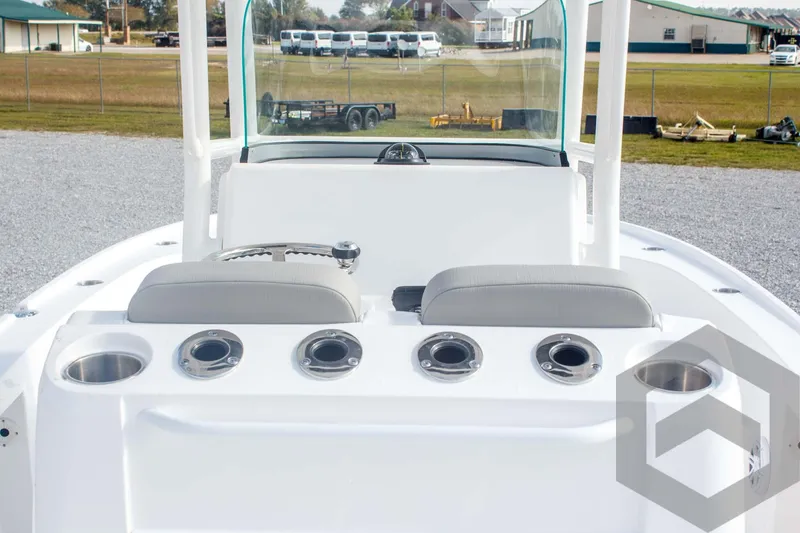 Slide: The Image of 2025 Caymas 26 HB boat interior with seating and cup holders. - 43