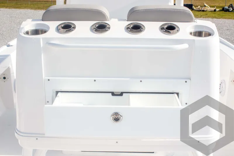 Slide: The Image of 2025 Caymas 26 HB boat console with cup holders and storage drawer. - 45