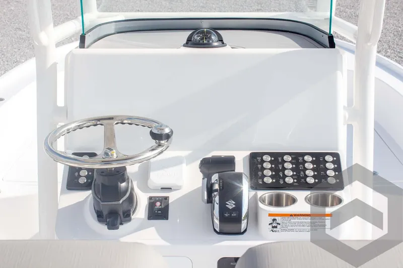 Slide: The Image of 2025 Caymas 26 HB boat dashboard with steering wheel and controls. - 46
