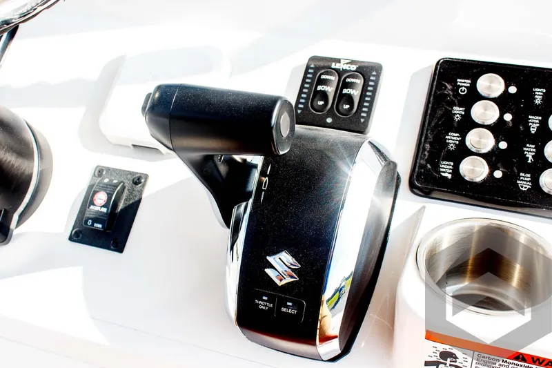 Slide: The Image of Control panel of 2025 Caymas 26 HB boat with Suzuki throttle. - 49
