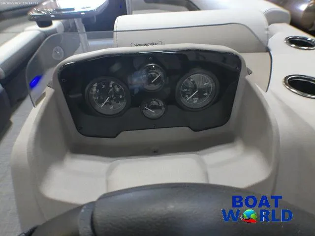 Slide: The Image of 2025 Princecraft Vectra 23 RL pontoon dashboard with gauges, steering wheel, and cup holders. - 15