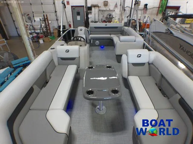 Slide: The Image of 2025 Princecraft Vectra 23 RL pontoon boat interior with lounge seating and table. - 9