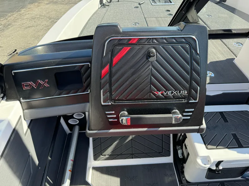 Slide: The Image of 2025 Vexus DVX20S boat interior with sleek black and red design. - 10
