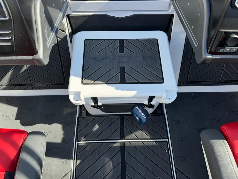 Slide: The Image of 2025 Vexus DVX20S boat interior with black and white seating and flooring. - 13