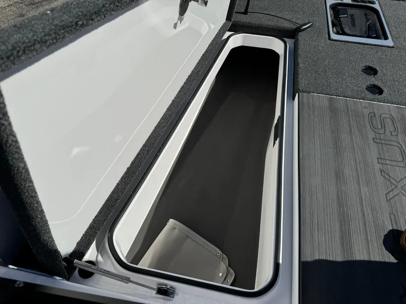 Slide: The Image of Open storage compartment in 2025 Vexus DVX20S boat. - 20