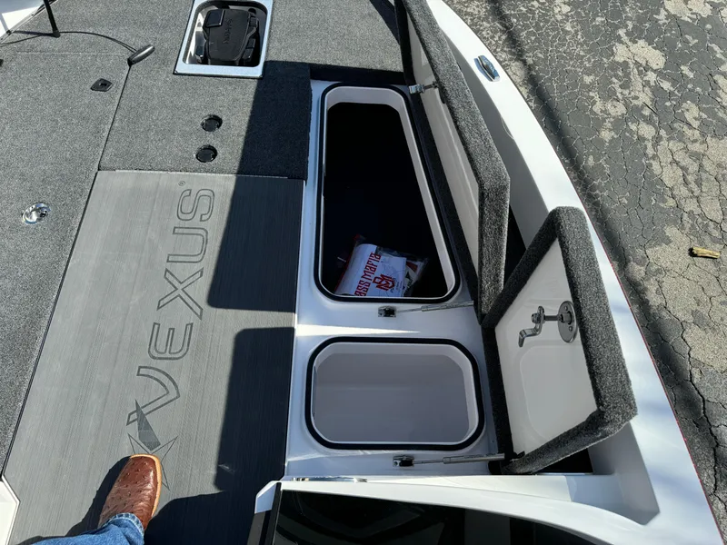 Slide: The Image of 2025 Vexus DVX20S boat deck with storage compartments open. - 21