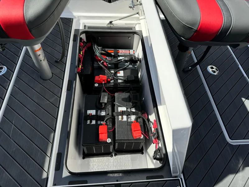 Slide: The Image of 2025 Vexus DVX20S boat battery compartment with wiring and seating. - 25