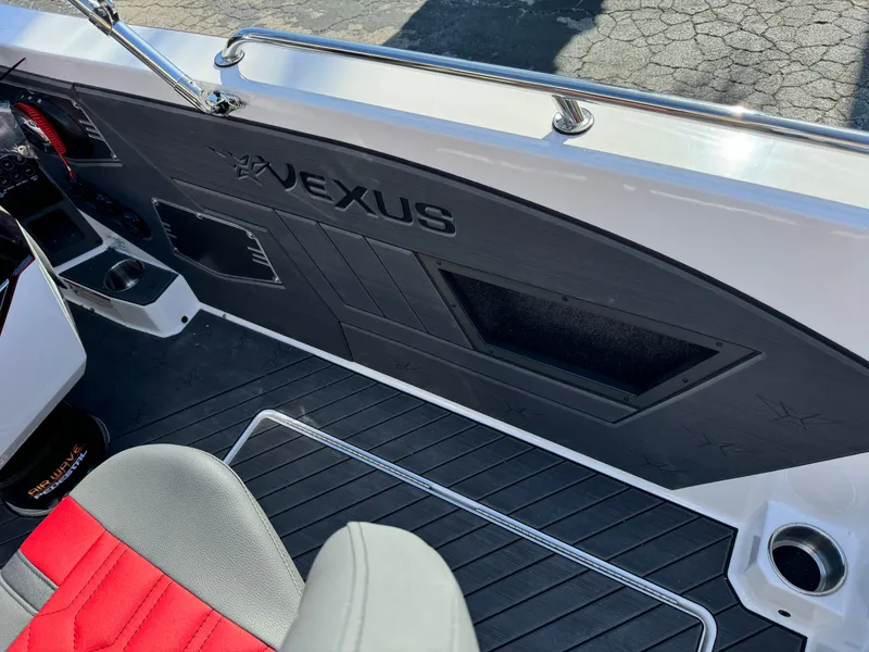 Slide: The Image of 2025 Vexus DVX20S boat interior with red and gray seating, sleek design. - 26