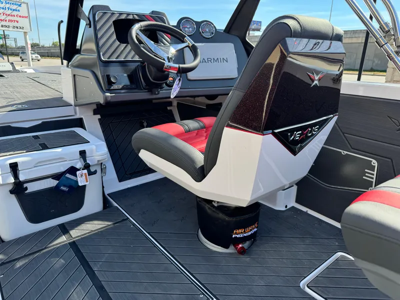 Slide: The Image of 2025 Vexus DVX20S boat interior with Garmin dashboard and stylish seating. - 29