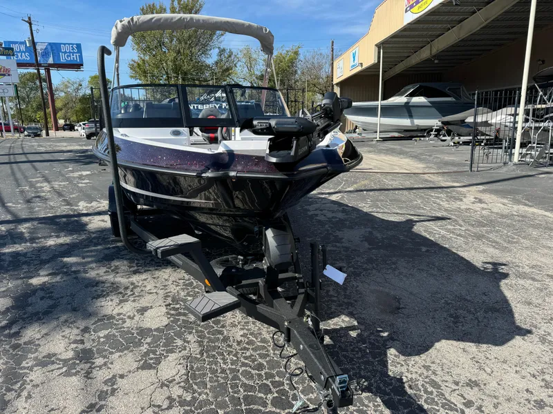 Slide: The Image of 2025 Vexus DVX20S boat on trailer in outdoor dealership lot. - 3