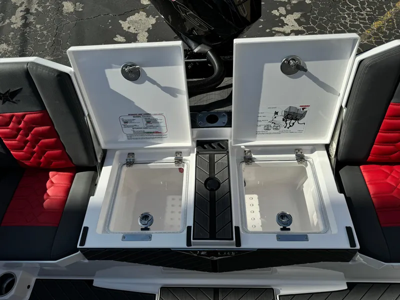 Slide: The Image of Vexus DVX20S 2025 boat interior with open storage compartments and red cushioned seats. - 33