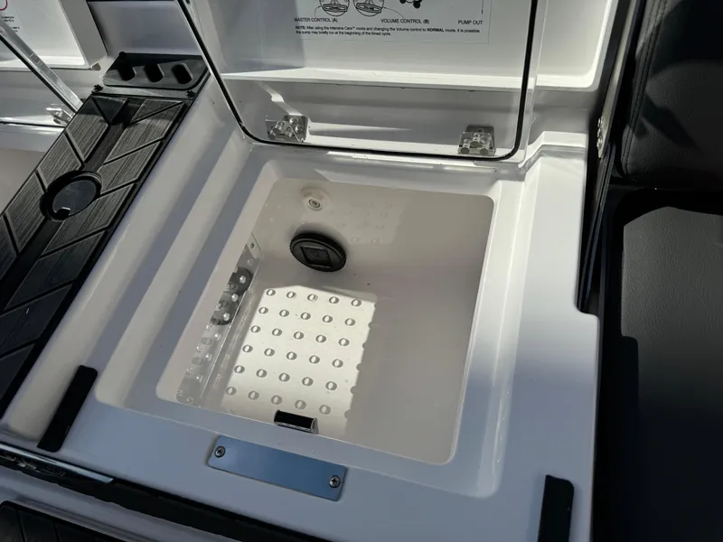 Slide: The Image of 2025 Vexus DVX20S boat storage compartment with open lid, showcasing interior design. - 35