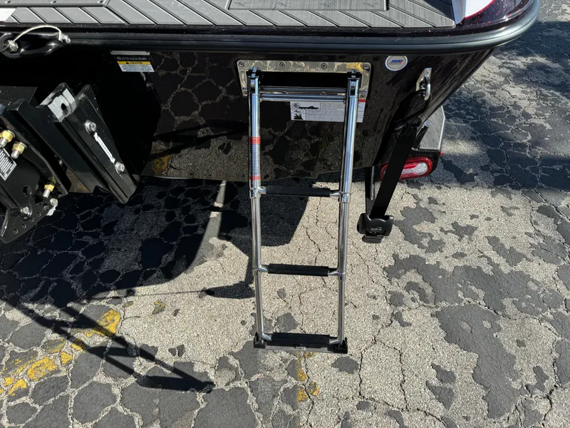 Slide: The Image of 2025 Vexus DVX20S boat with a retractable ladder on a textured surface. - 37