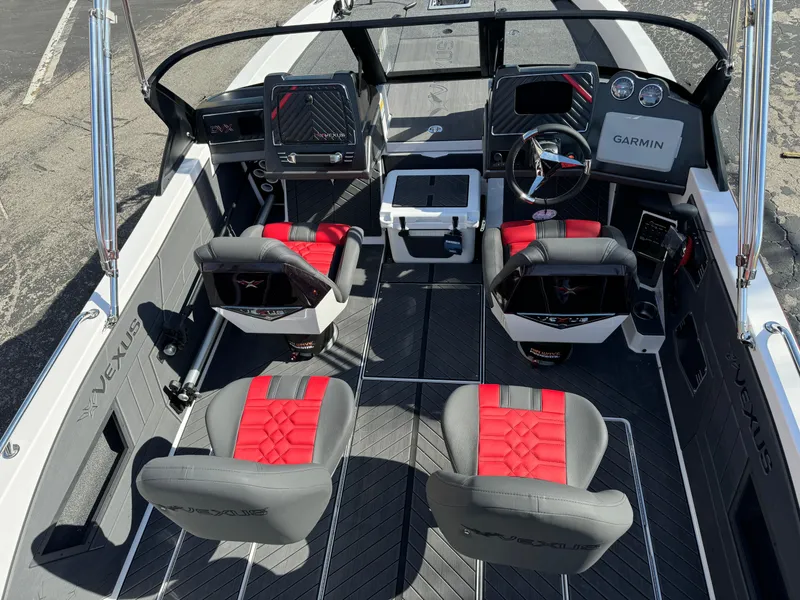 Slide: The Image of 2025 Vexus DVX20S boat interior with red and gray seating, Garmin navigation system. - 4