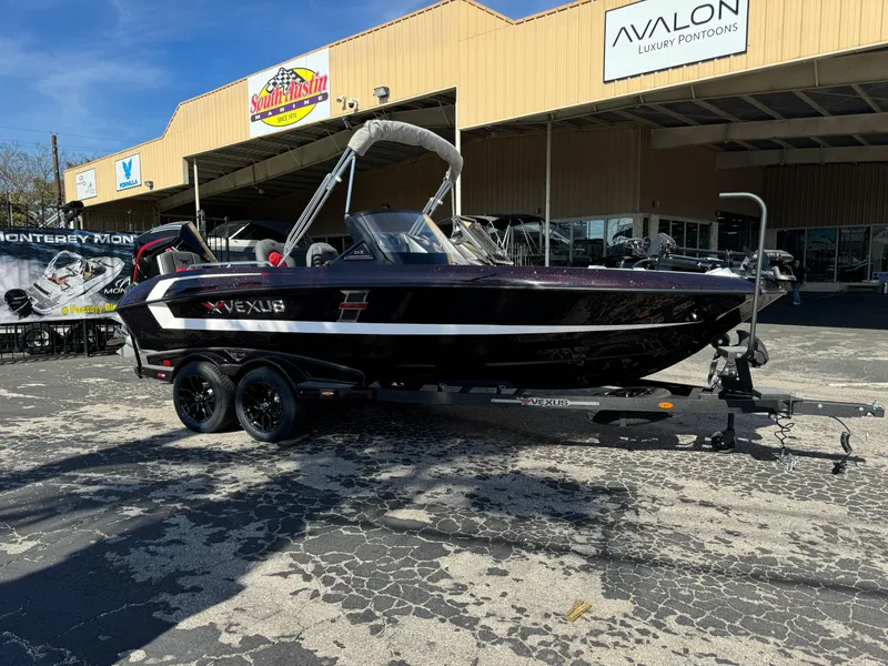 Slide: The Image of 2025 Vexus DVX20S boat on trailer outside dealership. - 42