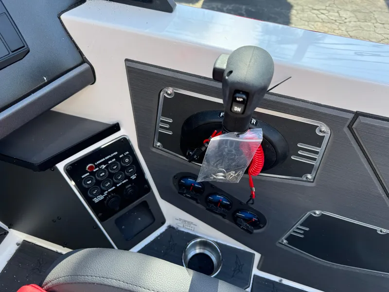 Slide: The Image of Control panel of 2025 Vexus DVX20S boat with throttle and switches. - 8