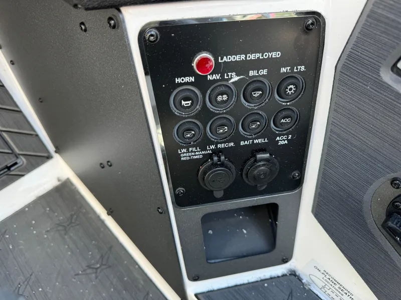 Slide: The Image of Control panel of 2025 Vexus DVX20S boat with various switches and indicators. - 9