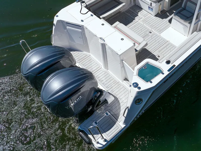 Slide: The Image of Solara S-310 CW 2025 boat with dual engines on water. - 29