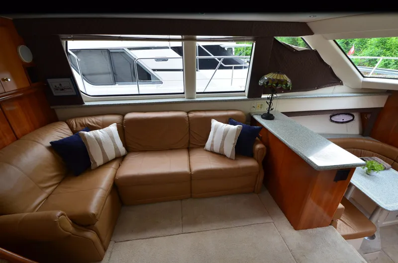 Slide: The Image of Luxurious interior of a 2001 Carver 406 yacht with leather seating and elegant decor. - 13