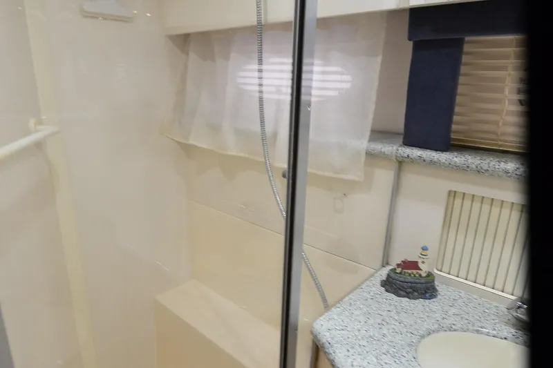 Slide: The Image of Bathroom interior of 2001 Carver 406 yacht with shower and sink. - 30