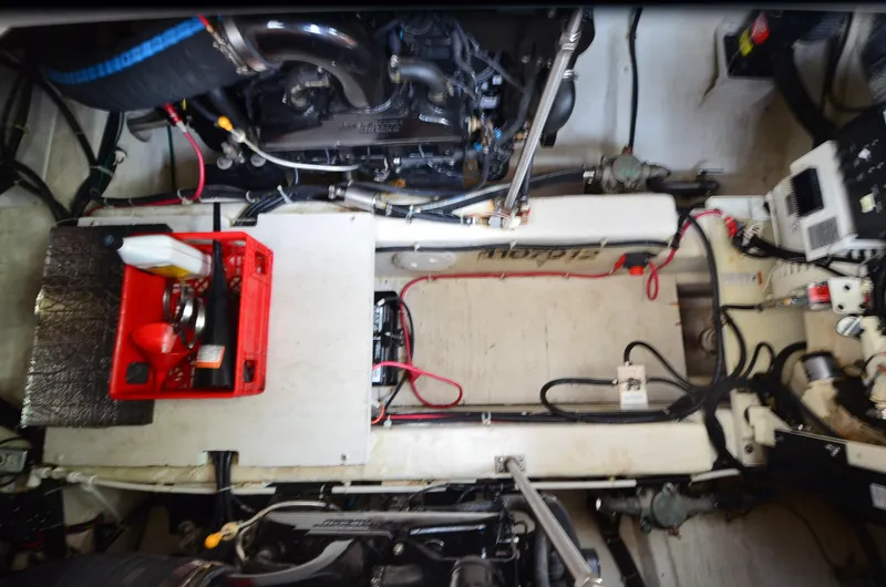 Slide: The Image of Engine room of a 2001 Carver 406 yacht, featuring mechanical components and wiring. - 34