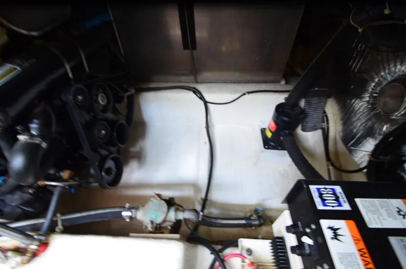 Slide: The Image of Engine compartment of a 2001 Carver 406 boat, showing mechanical components and wiring. - 36