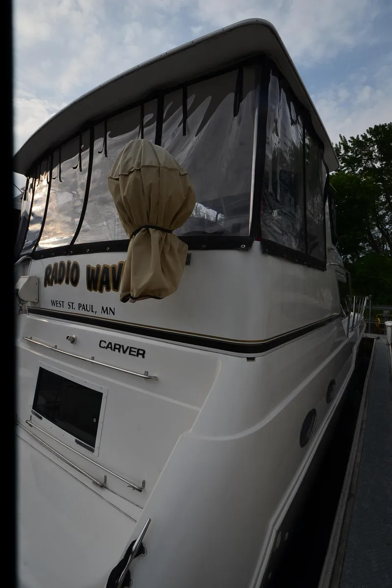 Slide: The Image of Carver 406 yacht, 2001 model, docked with covered windows, labeled "Radio Waves," West St. Paul, MN. - 48