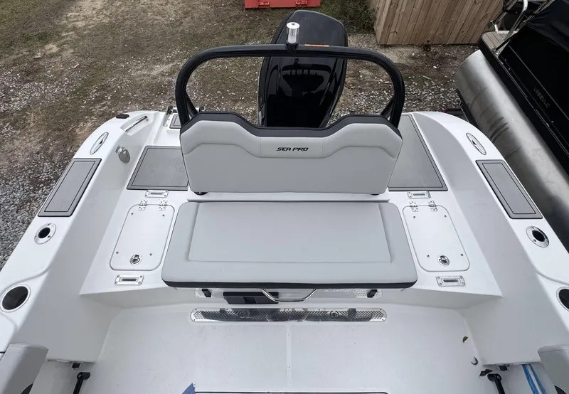 Slide: The Image of 2025 Sea Pro 245 SANDBAR boat interior with seating and storage compartments. - 4
