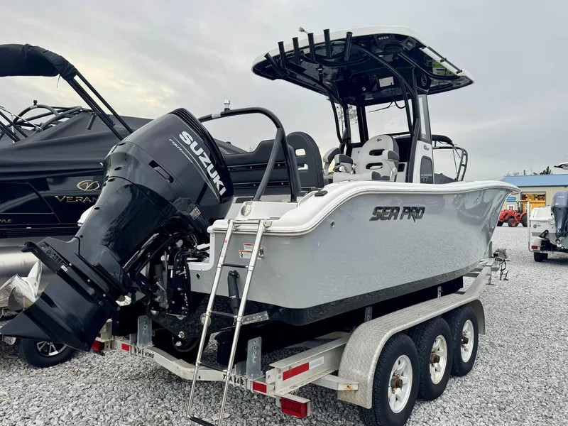 Slide: The Image of 2025 Sea Pro 245 SANDBAR boat with Suzuki outboard engine on trailer. - 6