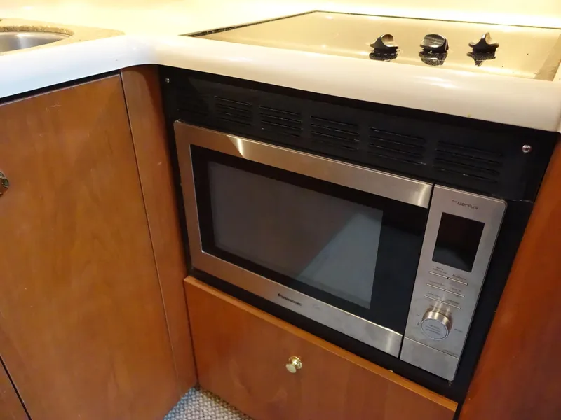 Slide: The Image of Microwave in 2001 Cruisers Yachts 4270 Express kitchen area. - 13