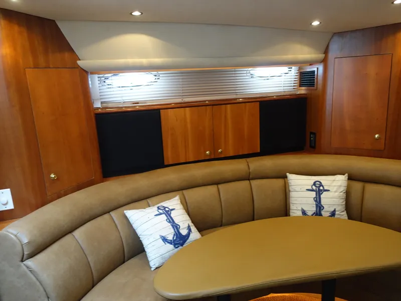 Slide: The Image of Luxurious interior of 2001 Cruisers Yachts 4270 Express with plush seating and nautical decor. - 15