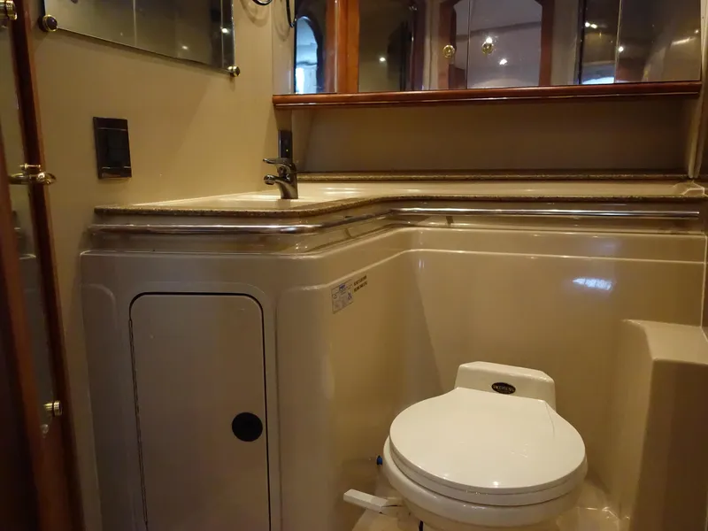 Slide: The Image of 2001 Cruisers Yachts 4270 Express bathroom with sink and toilet. - 25