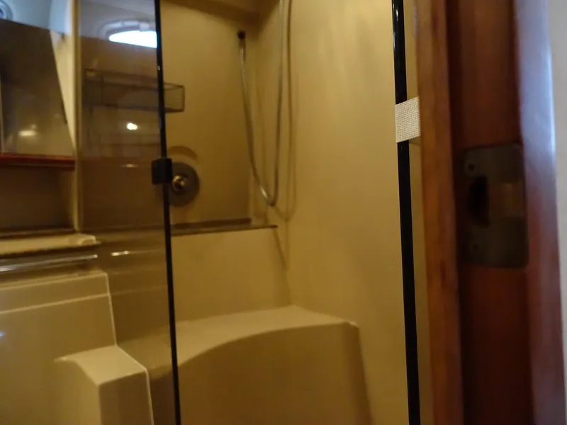 Slide: The Image of Bathroom interior of 2001 Cruisers Yachts 4270 Express with glass shower door. - 26