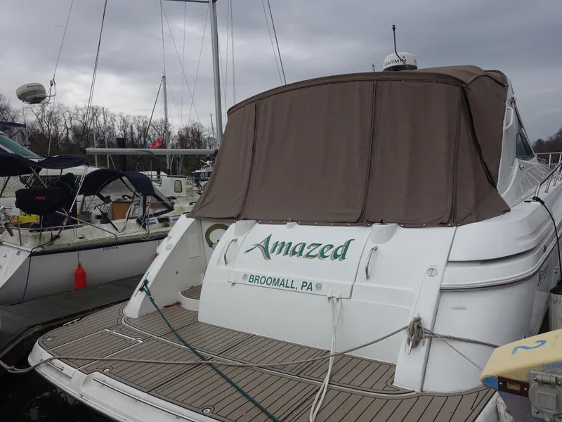 Slide: The Image of 2001 Cruisers Yachts 4270 Express docked, rear view with cover, named "Amazed," Broomall, PA. - 3