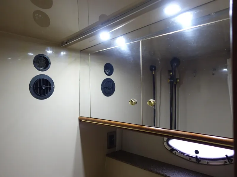 Slide: The Image of 2001 Cruisers Yachts 4270 Express bathroom with mirrors and lighting. - 34