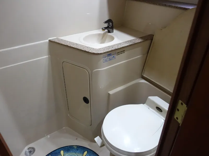 Slide: The Image of 2001 Cruisers Yachts 4270 Express bathroom with sink and toilet. - 35