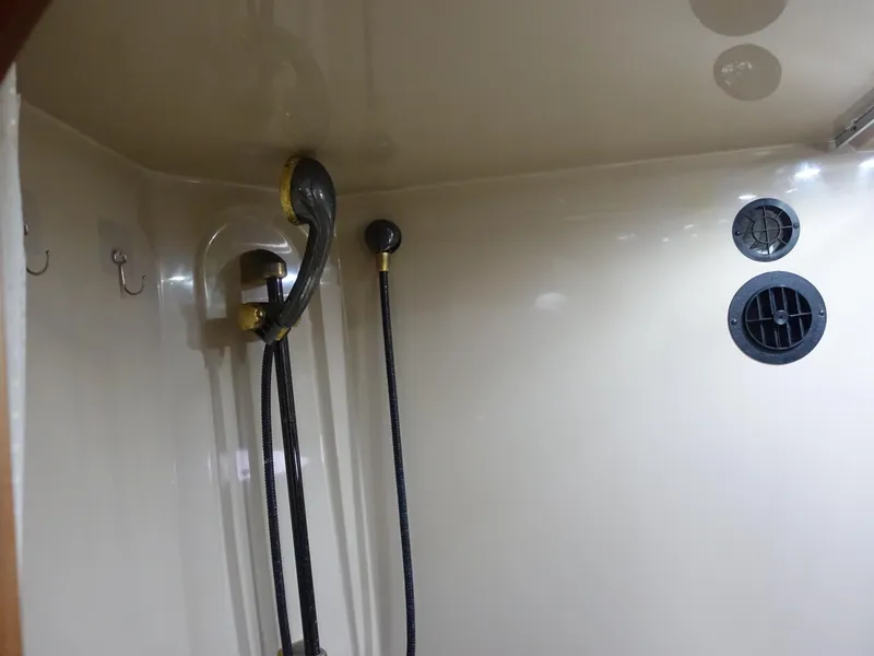 Slide: The Image of 2001 Cruisers Yachts 4270 Express shower area with modern fixtures and ventilation. - 36