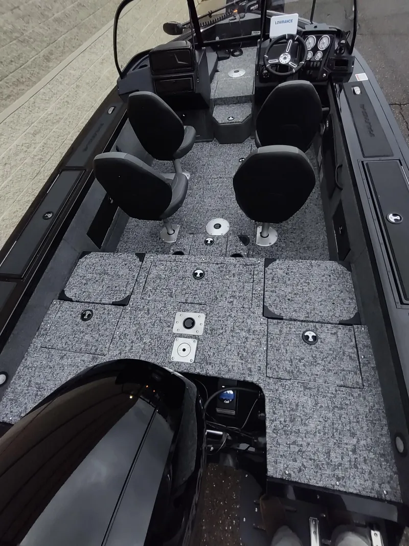 Slide: The Image of 2025 Tracker Targa V-18 Combo boat interior with seating and control panel. - 4